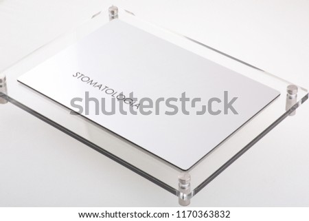 STOMATOLOGIA - Plastic blank with text on white  background. Silver color. Poland 