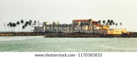 Panorama of Elmina Castle (also called the Castle of St. George) which is located on the Atlantic coast of Ghana west of the capital, Accra. It is a UNESCO World Heritage Site. Royalty-Free Stock Photo #1170383833