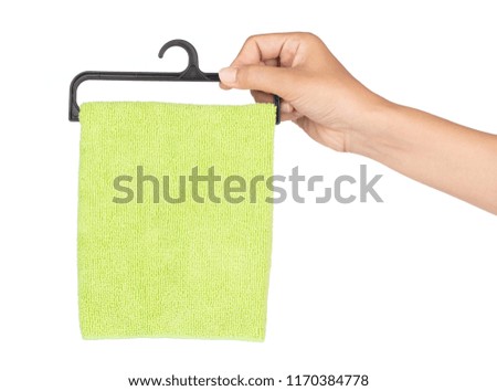 hand holding towel on a hanger isolated on a white background.
