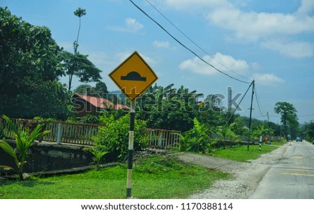 Yellow bump sign on the road at Klang, Selangor, Malaysia.