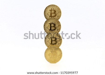 Four Bitcoin tokens stacked isolated on white background. Cryptocurrency concept with copy space.