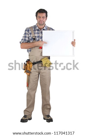 Handyman pointing to poster