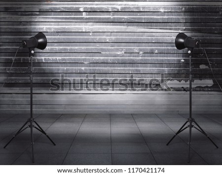 photo studio in old grunge room with metallic wall, urban background