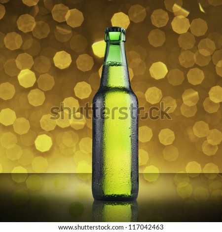Fresh cold green beer bottle on beautiful bokeh background