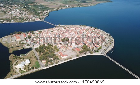 Aerial drone view of the famous island - fishing village of Aitoliko in Aetolia - Akarnania, Greece situated in the middle of Messolongi archipelago known as the Little Venice of Greece Royalty-Free Stock Photo #1170450865