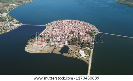Aerial drone view of the famous island - fishing village of Aitoliko in Aetolia - Akarnania, Greece situated in the middle of Messolongi archipelago known as the Little Venice of Greece Royalty-Free Stock Photo #1170450889