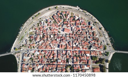 Aerial drone view of the famous island - fishing village of Aitoliko in Aetolia - Akarnania, Greece situated in the middle of Messolongi archipelago known as the Little Venice of Greece Royalty-Free Stock Photo #1170450898