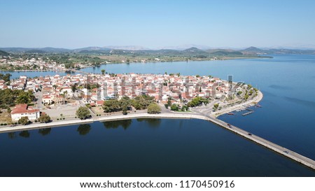 Aerial drone view of the famous island - fishing village of Aitoliko in Aetolia - Akarnania, Greece situated in the middle of Messolongi archipelago known as the Little Venice of Greece Royalty-Free Stock Photo #1170450916