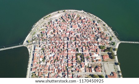 Aerial drone view of the famous island - fishing village of Aitoliko in Aetolia - Akarnania, Greece situated in the middle of Messolongi archipelago known as the Little Venice of Greece Royalty-Free Stock Photo #1170450925