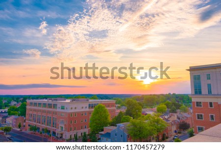 Aerial view of suburban houses and building and colorful sunset sky - West Chester, Pennsylvania, USA Royalty-Free Stock Photo #1170457279