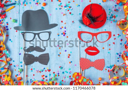 Colorful birthday or carnival frame with party items on stone background