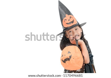 funny child girl in witch costume for Halloween with pumpkin Jack isolated on white background