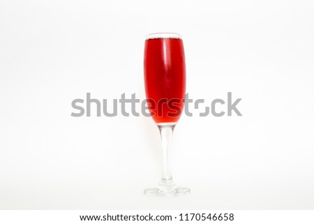 A glass of fresh pomegranate juice on white background