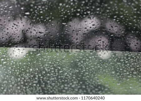 water droplets at car window can be use for background of an abstract. 