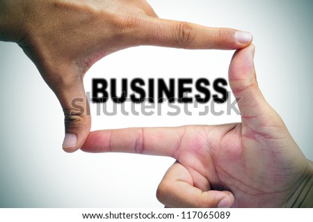 man hands making a frame with its fingers and the word business written inside