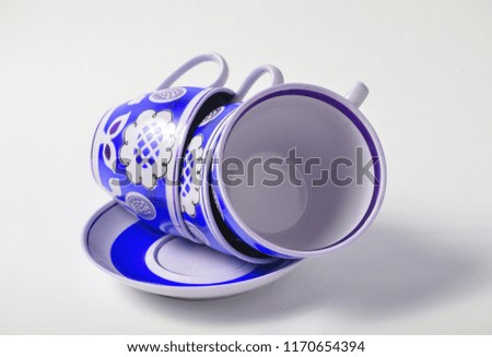 Stack of retro cups on a white background.
