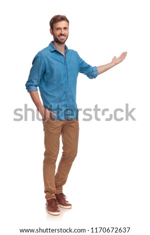 full body picture of a young casual man presenting something on white background