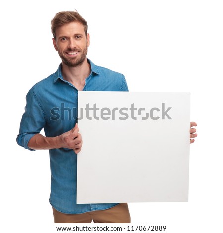 happy casual man holding a blank message on white bakground