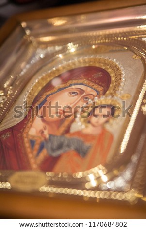 Icon of the Mother of God with the baby Jesus in the golden frame. close up