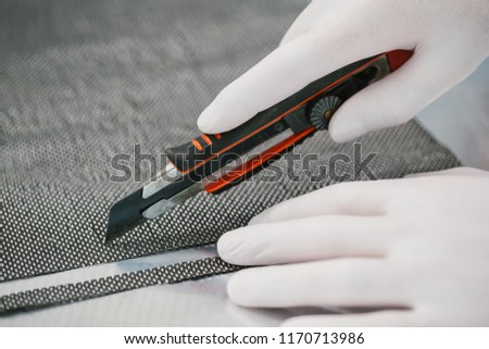 Cutting Raw Carbon fiber composite material with plastic utility knife