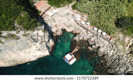 Aerial photo of speed boat in tropical turquoise bay