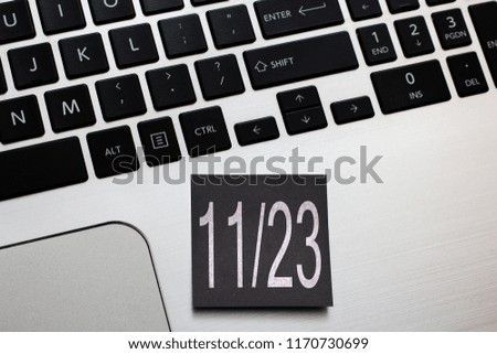 Black friday shopping sale. reminder on laptop. Text: 11/23