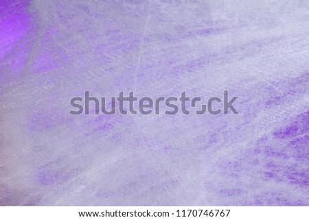 Halloween background decoration holiday concept. Full frame of cobweb on purple backdrop.