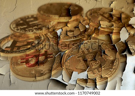 Bitcoin coins on an old broken background
