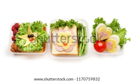 Creative appetizing sandwiches in lunch boxes on white background
