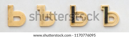 bright plastic cyrillic letters with magnet on white paper