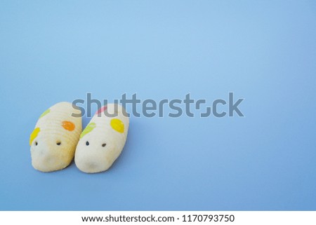 Pineapple cookies shaped like a worm,gray background