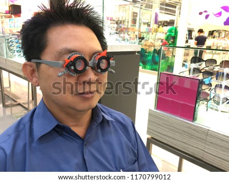 Man wearing glasses eyes test for make new eyesight glasses ,close up shot on top view,concept of visual impairment.