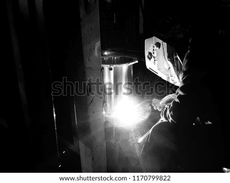 Welding workers and flame