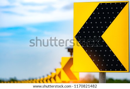 Traffic sign with solar cell panel power on blue sky and clouds background. Electric pole with solar energy. Green energy concept. Renewal energy. Alternative electricity source. Sustainable resources