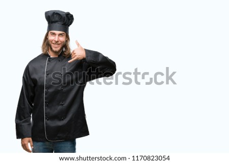 Young handsome cook man with long hair over isolated background smiling doing phone gesture with hand and fingers like talking on the telephone. Communicating concepts.