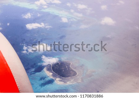 Aerial picture from an airplane of a small island around the island of southeast Sulawesi in Indonesia