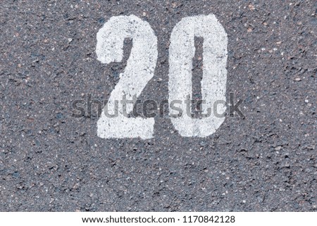 White number 20 on the asphalt, texture