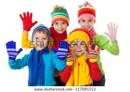 Group of kids in bright winter clothes, isolated on white