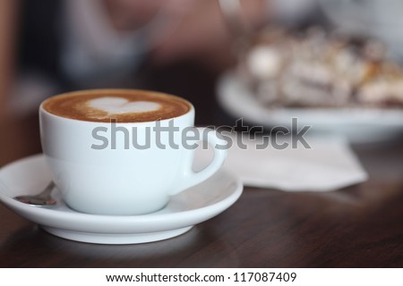cappuccino with foam and heart Royalty-Free Stock Photo #117087409