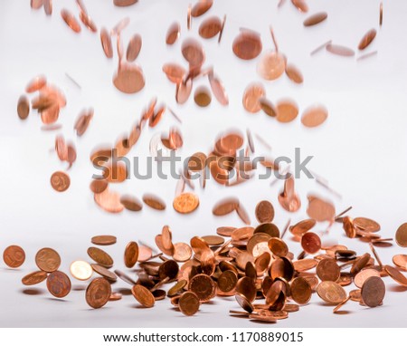 It is raining money. Copper coins falling from heaven like autumn leaves blown in the wind and whirling down.