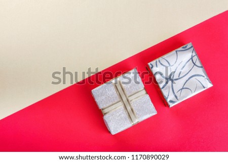 Golden gift box on  bright red background.Top view flat lay group objects
