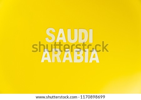 Saudi text on yellow background