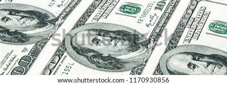 A solid sheet of one hundred dollar bills. Close-up.
