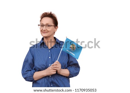 Oklahoma flag. Woman holding Oklahoma state flag. Nice portrait of middle aged lady 40 50 years old with a state flag isolated on white background.