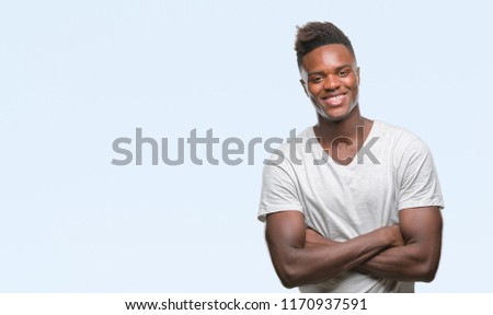 Young african american man over isolated background happy face smiling with crossed arms looking at the camera. Positive person.