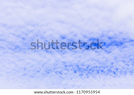 Background and texture of beautiful sky with feathery white clouds on a windy day