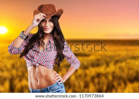 Portrait of a beautiful woman wearing  cowboy's hat