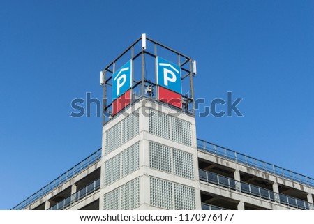 building with car park sign on top