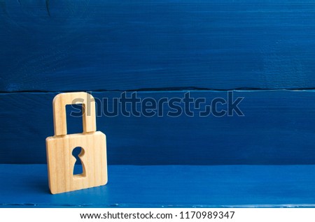 a wooden padlock on a blue background, information, entrance. concept of the preservation of secrets, information and values. Protection of data and personal information. Hacking attack, hacking