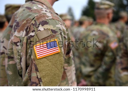 USA patch flag on soldiers arm. US troops Royalty-Free Stock Photo #1170998911